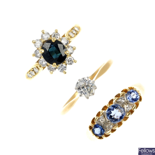 A selection of three gold diamond and gem-set rings. 