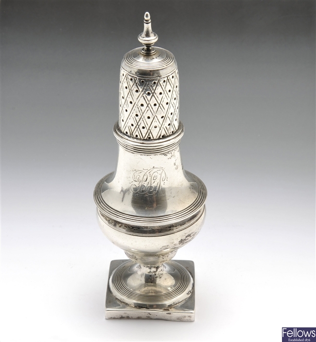 George III silver caster of baluster form.