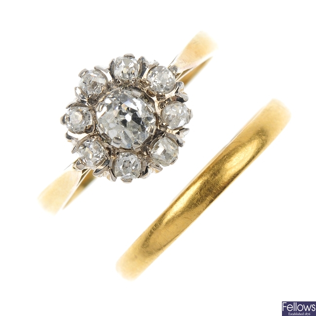  An 18ct gold diamond cluster ring and a 22ct band ring.