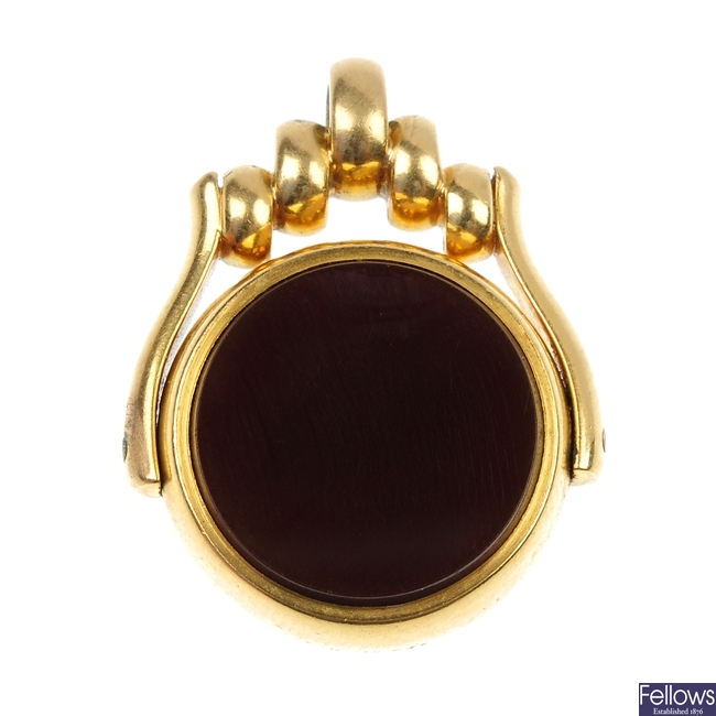 A late Victorian 18ct gold hardstone swivel fob.