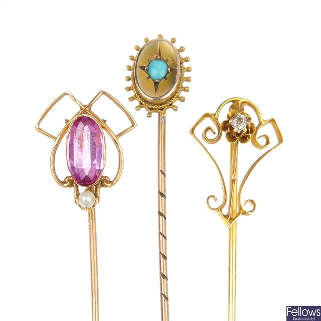A selection of three gem-set stick pins.