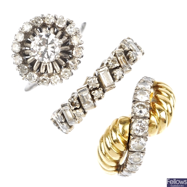 (117553-2-A) A selection of three gold diamond rings.