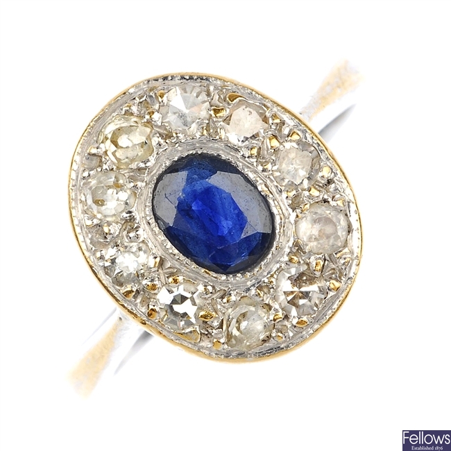 (526095-1-A) A sapphire and diamond ring.