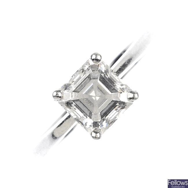 (526433-1-A) A platinum diamond square shape diamond ring.