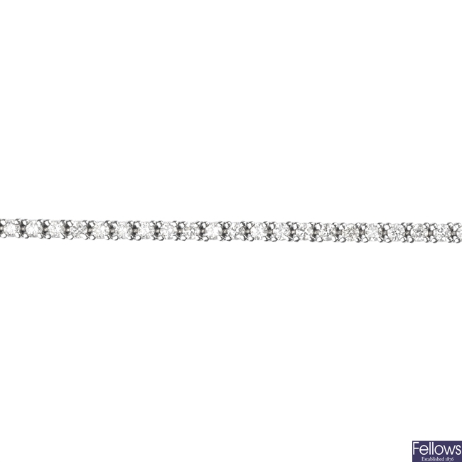 (526433-2-A)  A diamond line bracelet.