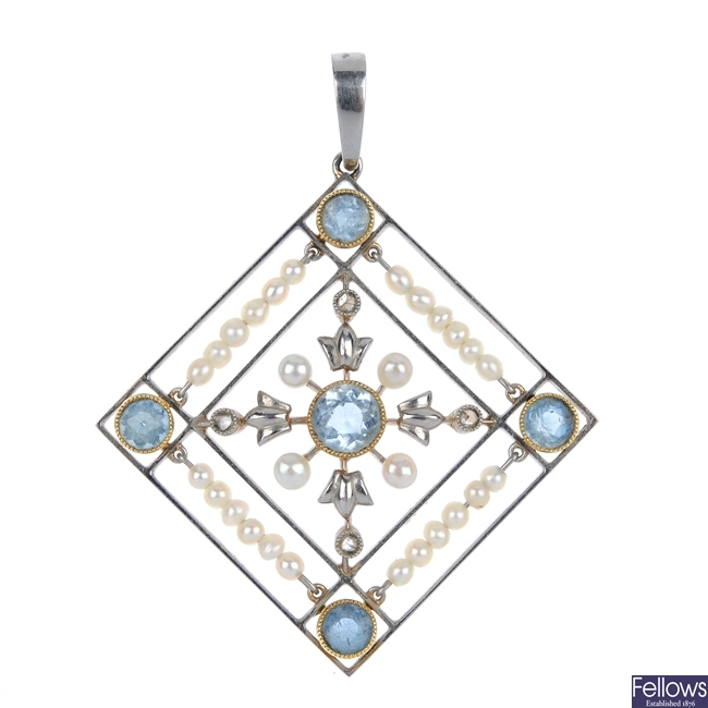 An early 20th century aquamarine and seed pearl pendant.