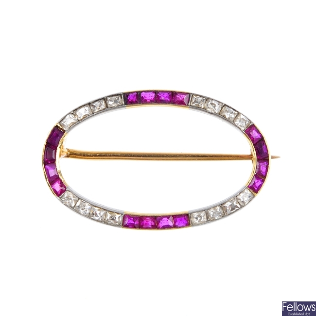 LA CLOCHE FRES - an early 20th century 18ct gold ruby and diamond brooch.