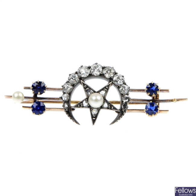 A late 19th century silver and gold gem-set crescent bar brooch.