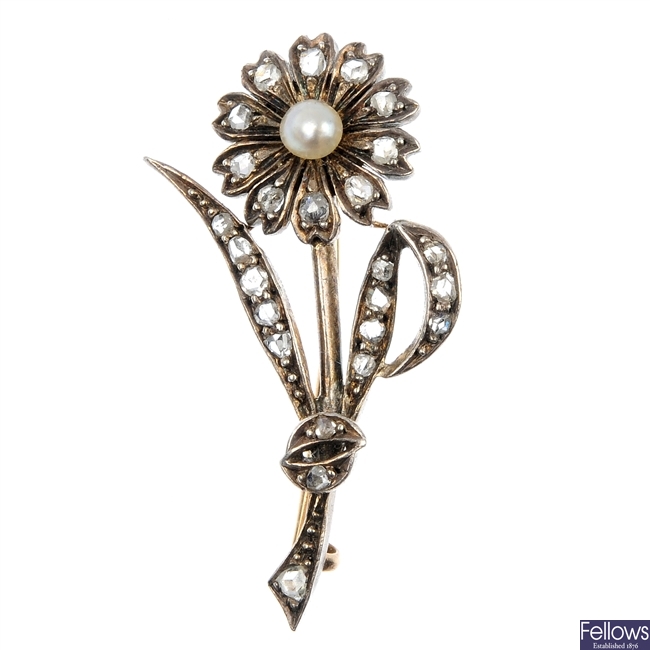 An early 20th century gold and silver seed pearl and diamond flower brooch.