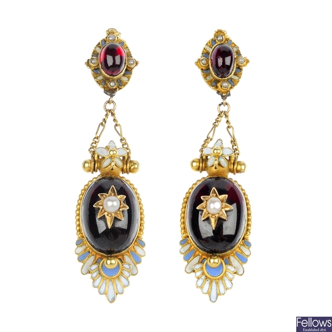 A pair of late 19th century gold garnet and enamel ear pendants.