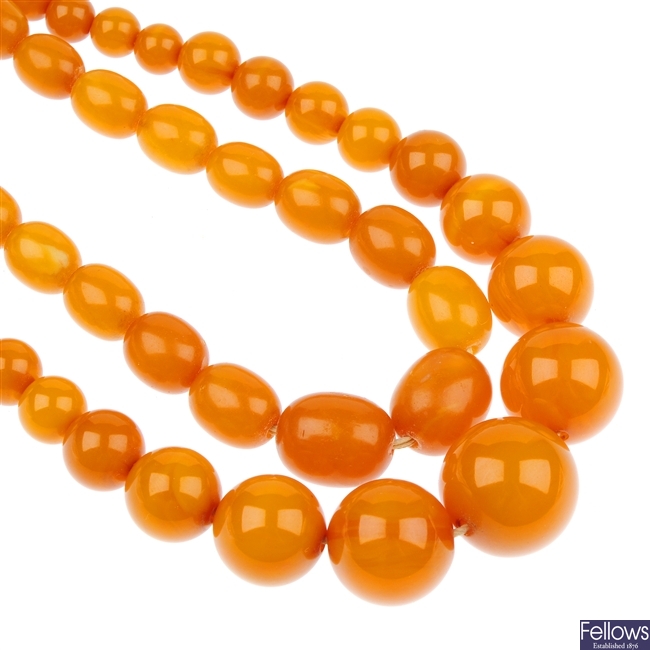 A reconstituted amber necklace and a bakelite necklace.