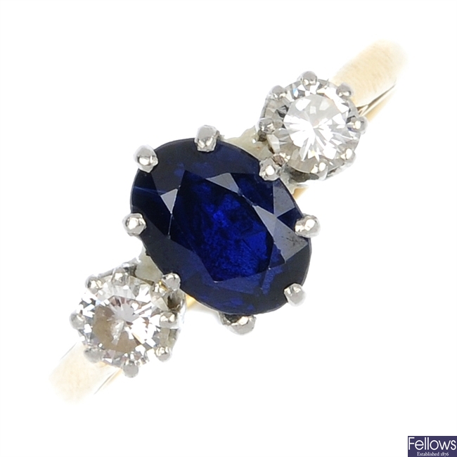 An 18ct gold and platinum sapphire and diamond three-stone ring.