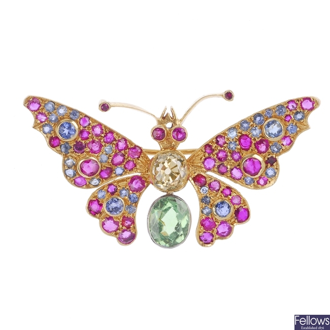 A gem-set butterfly brooch.