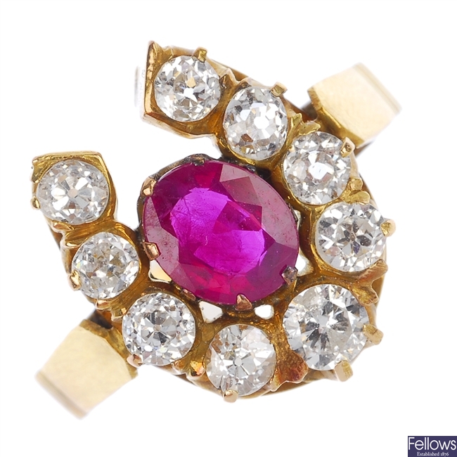 A mid 20th century 18ct gold ruby and diamond horseshoe ring.