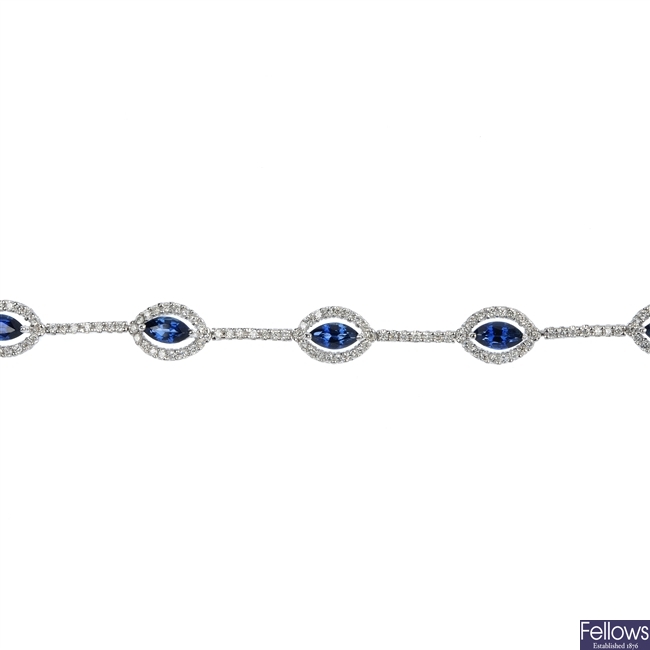 A sapphire and diamond line bracelet.