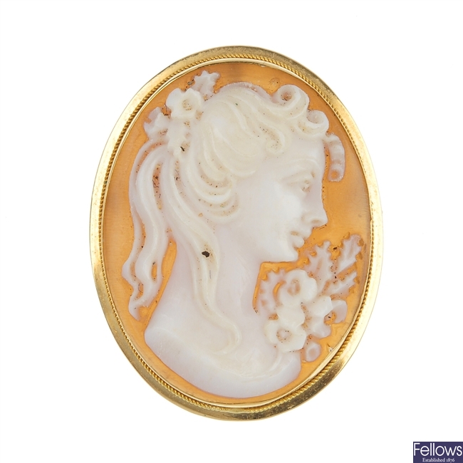 A cameo brooch and four pairs of ear studs.