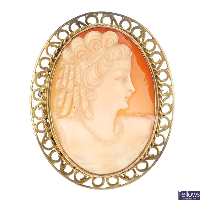 A shell cameo brooch and a garnet bead necklace.