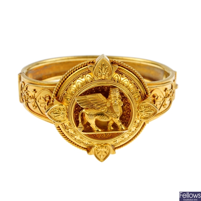 A late 19th century gold Assyrian revival hinged bangle.