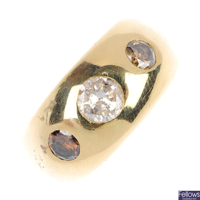 A gentleman's diamond three-stone ring.