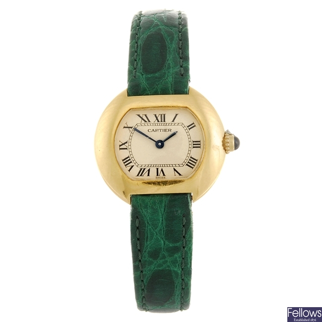 An 18k gold quartz Cartier wrist watch.