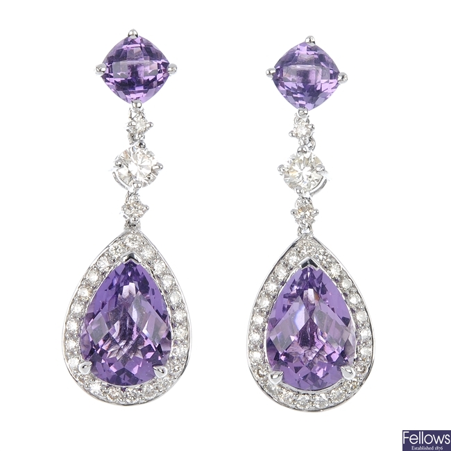A pair of diamond and amethyst ear pendants.