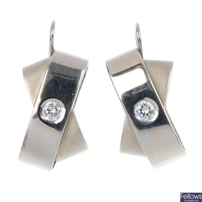  A pair of diamond-set earrings.