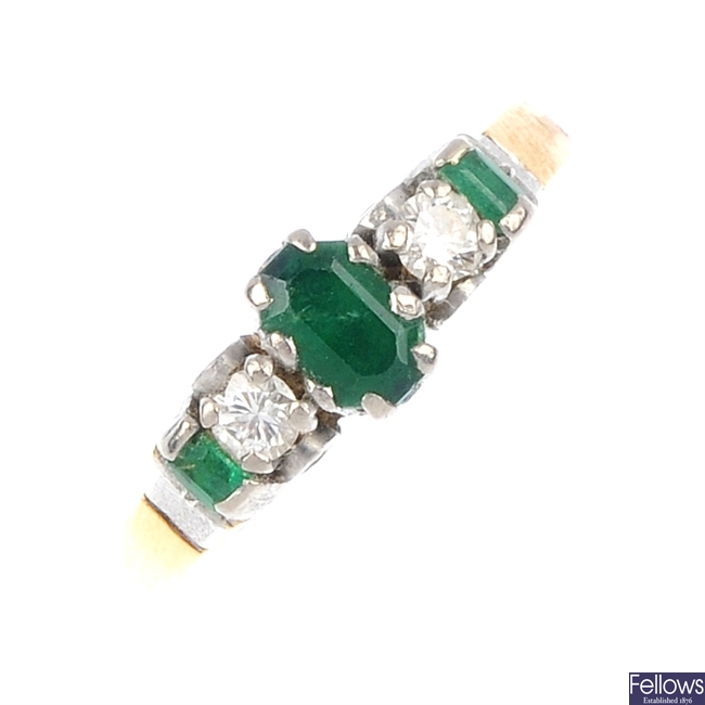 An emerald and diamond five-stone ring.