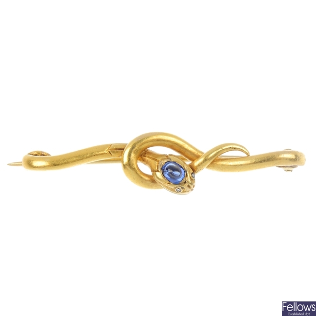 A late 19th century gold sapphire and diamond snake brooch.