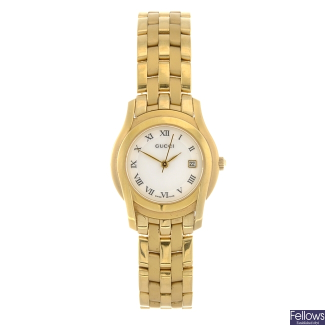 A gold plated quartz lady's Gucci bracelet watch.