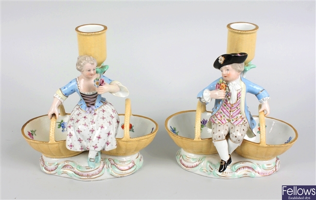 LOT:48  A pair of Meissen porcelain figural candlesticks