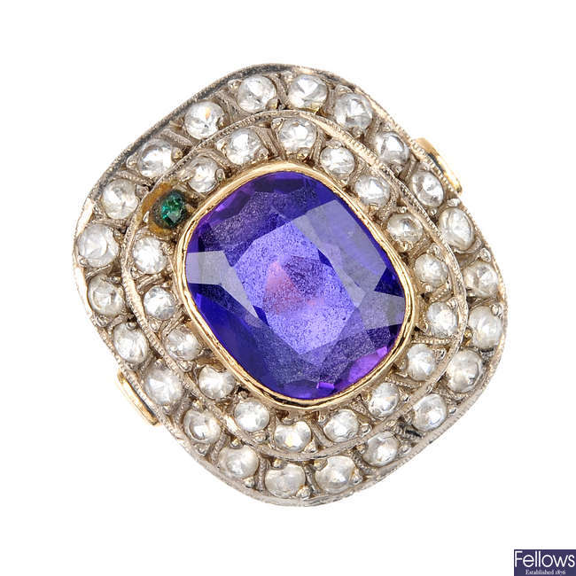 A synthetic colour change sapphire and paste ring.