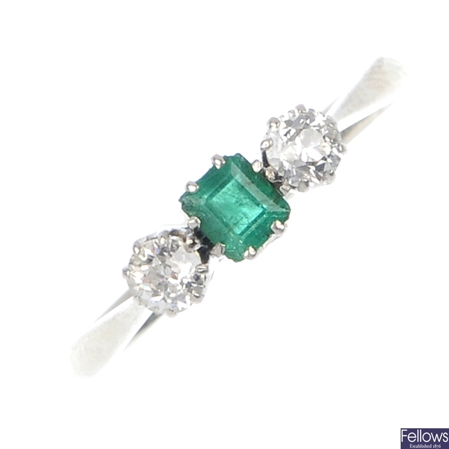 An early 20th century 18ct gold emerald and diamond three-stone ring.