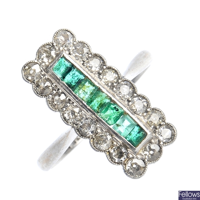 A mid 20th century emerald and diamond dress ring.
