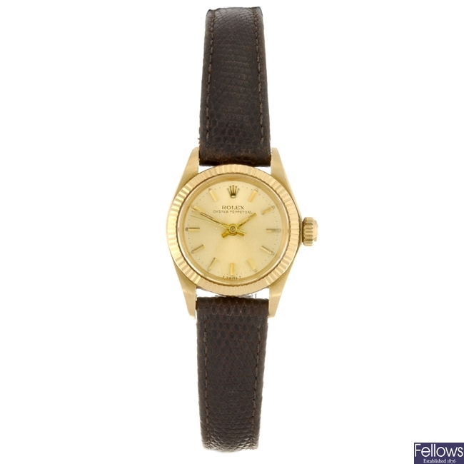 An 18k gold automatic lady's Rolex Oyster Perpetual wrist watch.