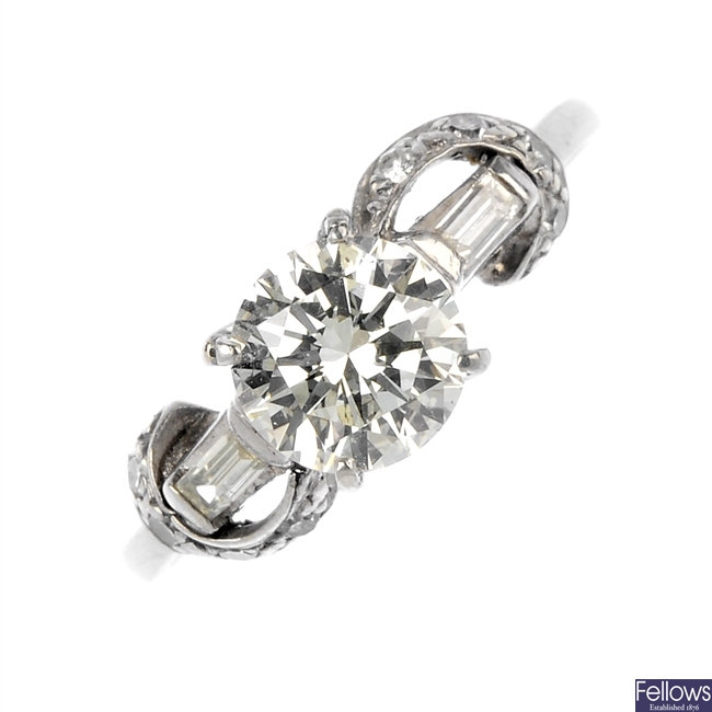 A mid 20th century platinum and 18ct gold diamond single-stone ring.