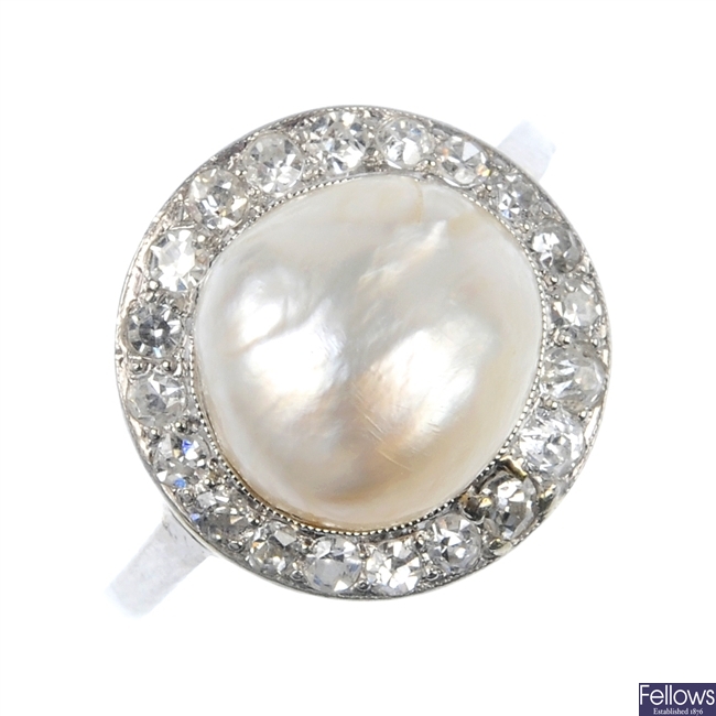 An early 20th century platinum baroque pearl and diamond ring.