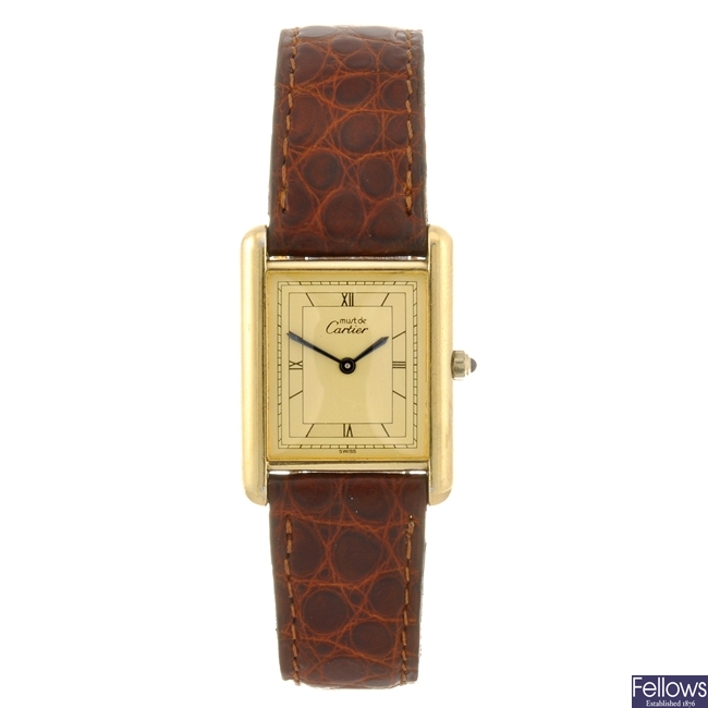 A gold plated quartz Must De Cartier wrist watch.