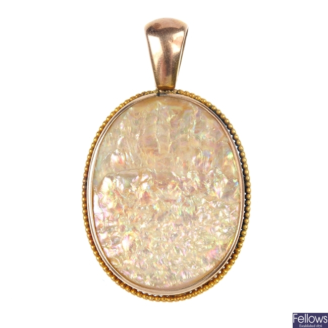 A mother-of-pearl pendant.