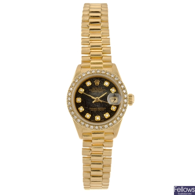 An 18k gold automatic lady's Rolex Datejust bracelet watch.
