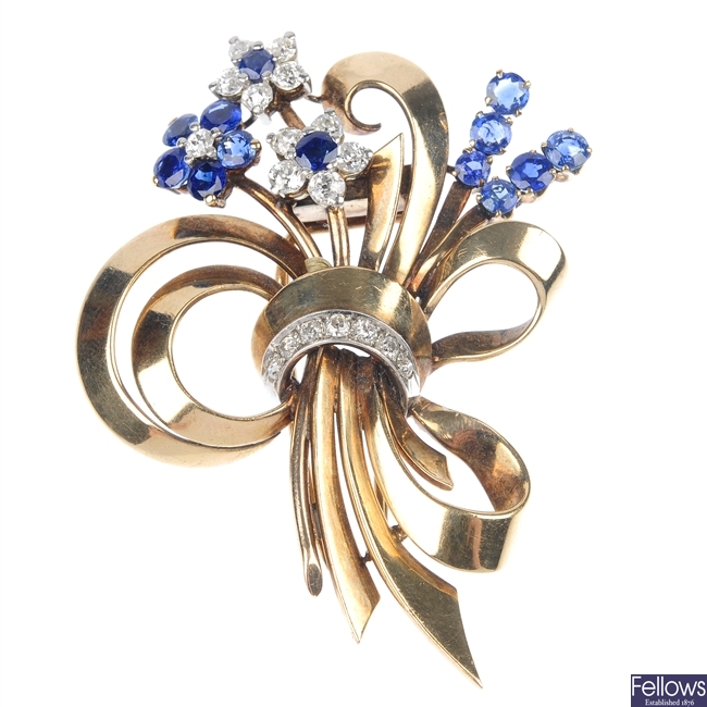 A mid 20th century gold diamond and sapphire floral spray brooch.