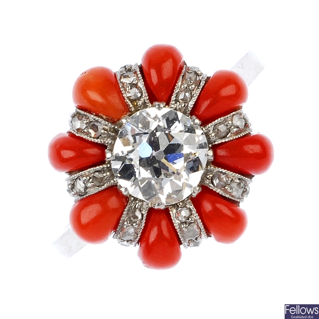 An early 20th century platinum diamond and coral cluster ring.