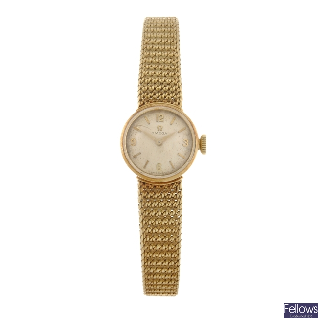 A 14k gold manual wind lady's Omega bracelet watch.