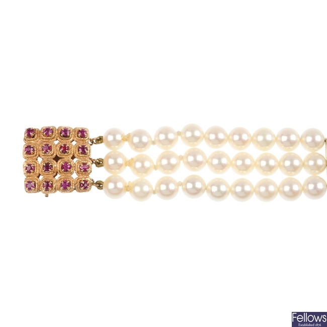 A cultured pearl three-row bracelet.