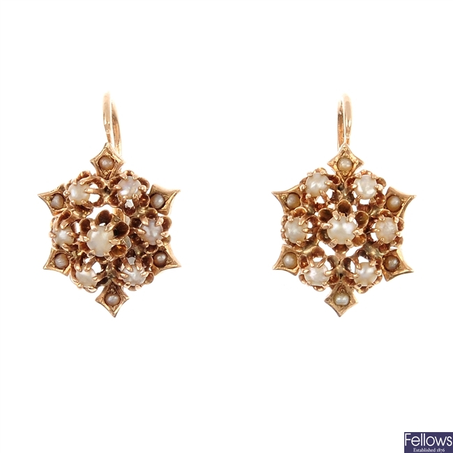 A pair of seed pearl cluster earrings.