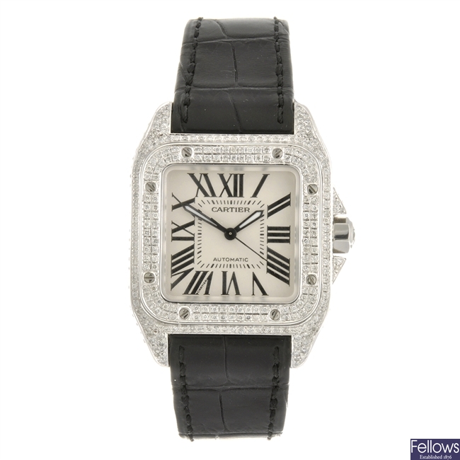 A stainless steel automatic Cartier Santos bracelet watch.
