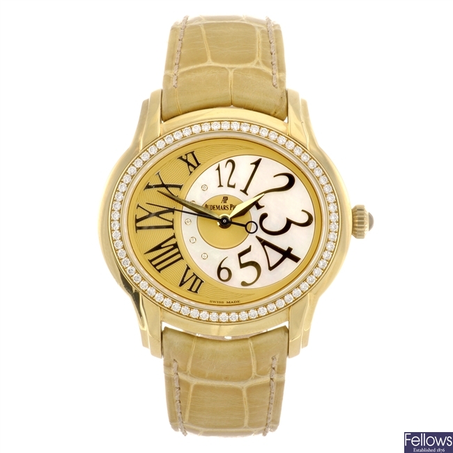 An 18k gold automatic Audemars Piguet Millenary wrist watch.