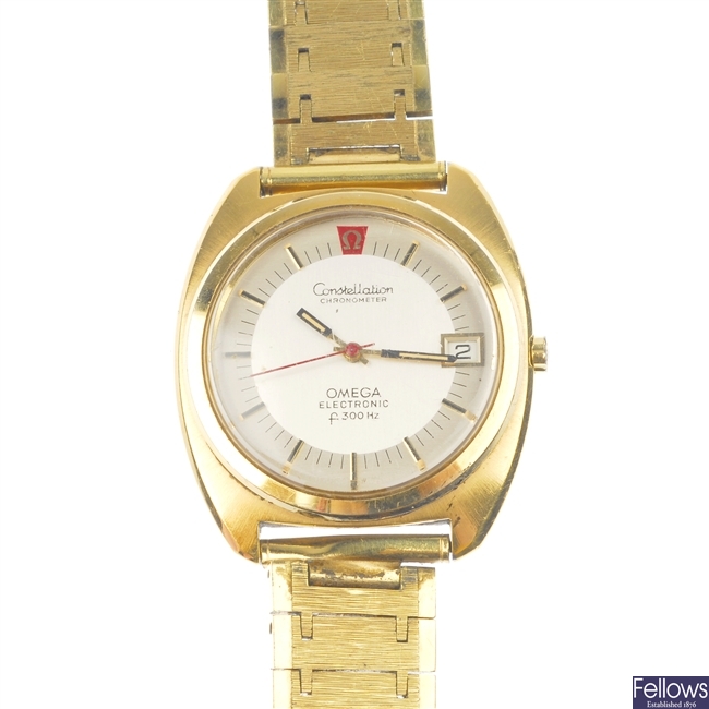 A gold plated Omega Constellation Electronic F300Hz bracelet watch.