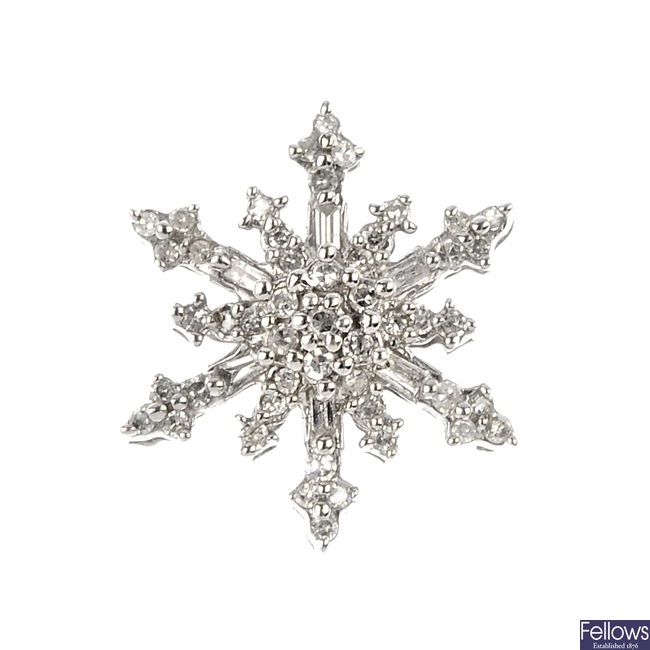 A diamond snowflake pendant.