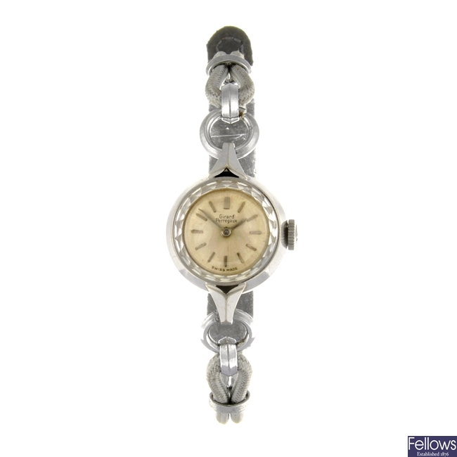 An 18k white gold manual wind lady's Girard Perregaux wrist watch.