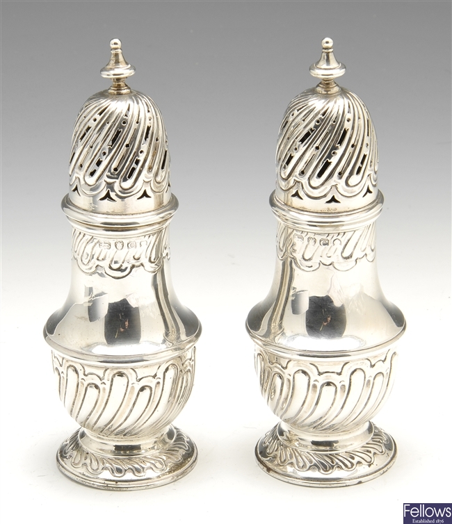 A pair of George III silver casters.